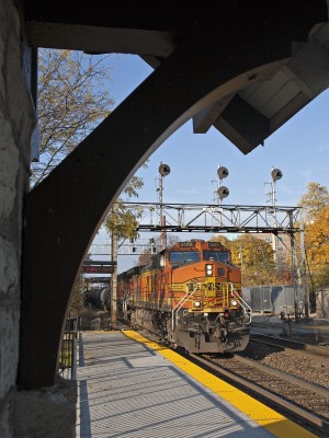 BNSF eastbound freight train passing the Highsland Station in Hinsdale, Illinois, on November 6, 2011. The CB&Q signal bridge is just days from replacement; the new signals are waiting to be cut-in behind it.