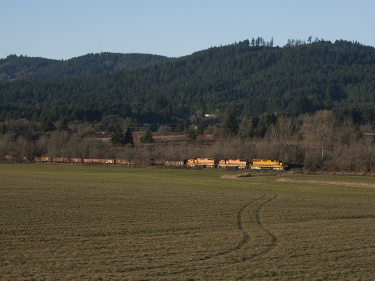 Portland and Western's Westsider freight train rolls through the fields near McMinnville on an unusually clear December day in 2009.