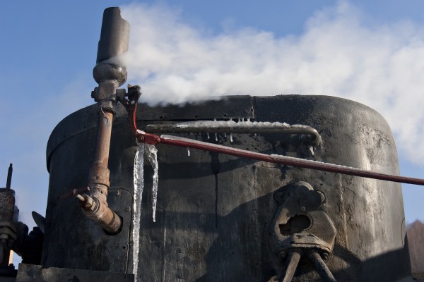 Icicles cling to the rods and handles of the whistle and steam dome of an 0-8-0 C2 locomotive of the Huanan Forestry Railway in Lixin, Heilongjiang, China, on December 2, 2005.