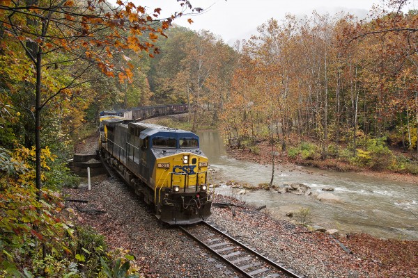 CSX eastbound unit coal train running along Laurel Creek near Centralia, West Virginia, on the remote Cowen Subdivision.