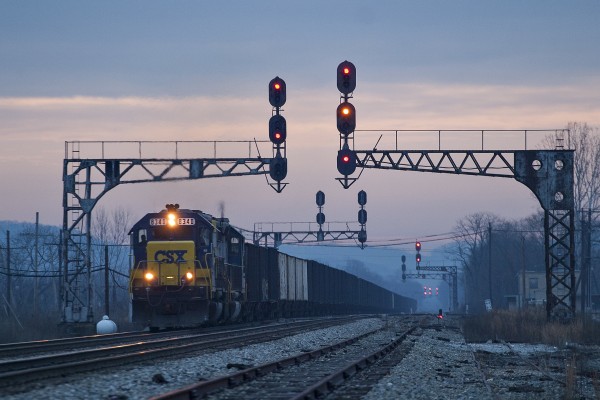 CSX westbound empty coal train passing under the former Chesapeake & Ohio signals in St. Albans, West Virginia, at dawn on the day after Christmas, 2004.