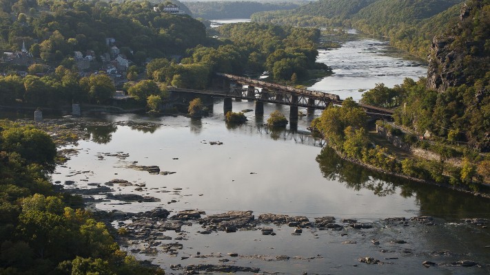 CSX eastbound loaded coal train crossing the Potomac River at Harpers Ferry, West Virginia.