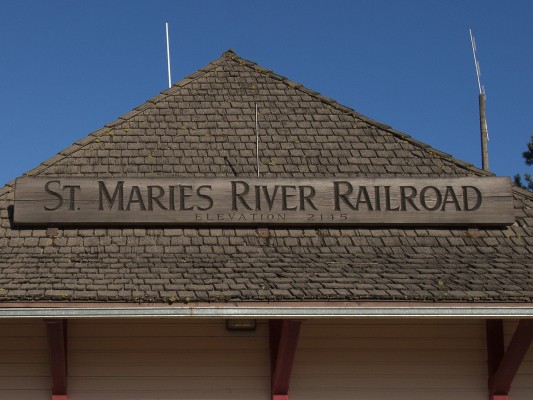 Carved wood sign for the St. Maries River Railroad on the depot in St. Maries, Idaho.