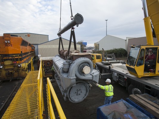 Portland and Western SD45 locomotive 3052 is set to become an SD40-3 with a new prime being delivered by crane at the railroad's Albany shops on November 5, 2009.