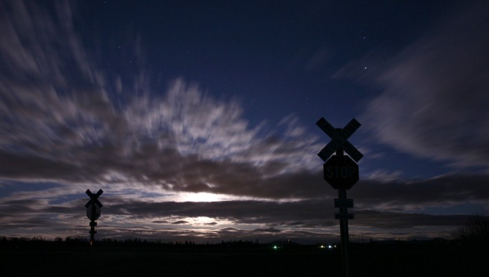 Clouds obscure the rising moon at the Harvest Drive crossing of Portland and Western's Oregon Electric District on February 9, 2009.