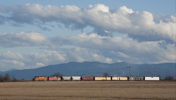 Portland and Western's American Turn rolls north near Harrisburg, Oregon, as clouds roll above the Cascade foothills in the distance on February 17, 2009.