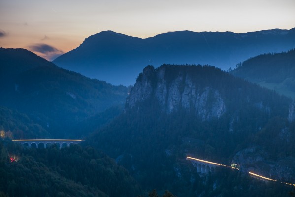 The 20-schilling view at dusk, as northbound freight train rolls downgrade.