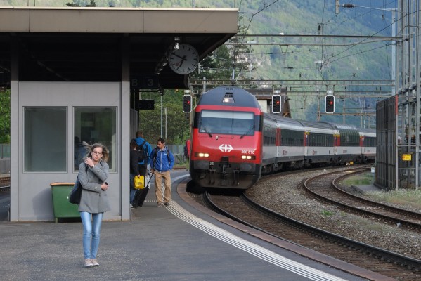 Passengers at Faido station prepare to board an InterRegio train north.