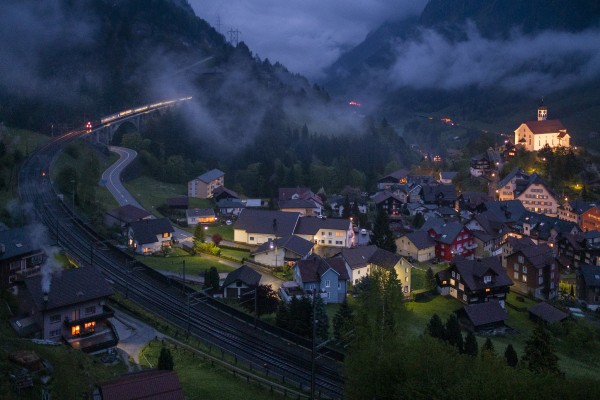 Running on the left-hand track just moments behind the tilting train in the previous view, an InterRegio passenger train descends the middle level of track at Wassen.