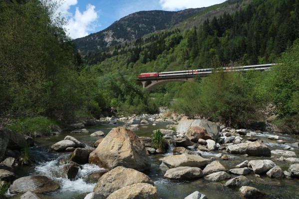 InterRegio passenger train north crossing the Polmengo Viaduct over the Ticino River near Faido, Switzerland.