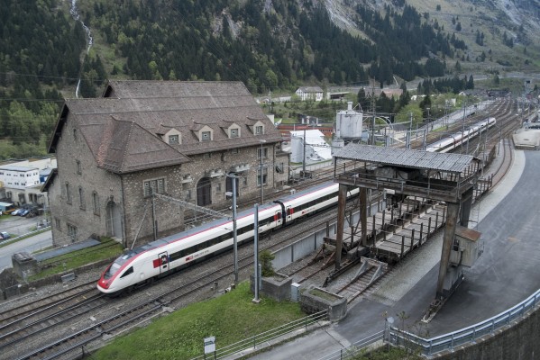 ICN train 692 from Lugano to Basel has just exited the Gotthard Tunnel and is passing through Göschenen station at the start of the steep descent to Erstfeld.