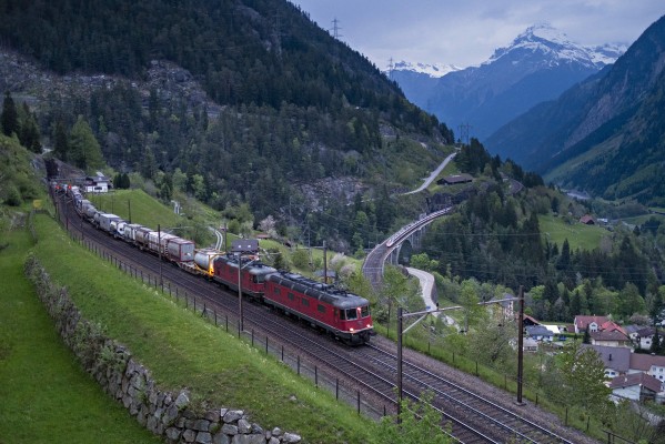 Freight climbs the grade on the upper level of track at Wassen while an ICN passenger train descends. <i>Note this is a merging of two separate exposures made ten seconds apart from one another.</i>