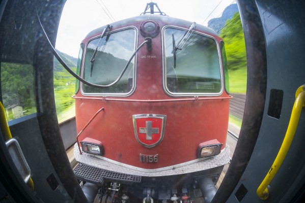 Swiss Federal Railways Re 420 electric 11156 (built in 1966 and fifty years old at the time) leads an InterRegio passenger train north near Giornico, Switzerland.