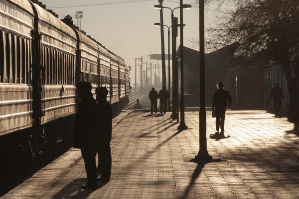 Passengers walk along the platform of the Zhalainuoer station on a cold morning.