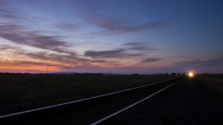 Amtrak <i>Cascades</i> train no. 507 rolls south in Oregon's Willamette Valley after sunset on August 14, 2008.