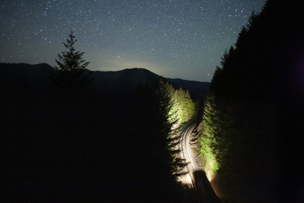 Stars fill the sky above Fields, Oregon, as a Union Pacific freight train heads south just after midnight on May 26, 2009. Memorial Day weekend has just ended, and this was the only train of the night—an especially lonely one camping above Tunnel 15.