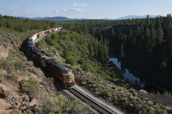 Union Pacific freight train rolling north above the Williamson River near Kirk, Oregon, late in the day of July 8, 2009.