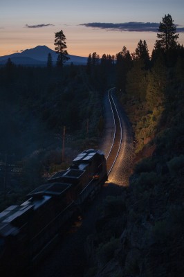 BNSF Railway freight train heading north on the Union Pacific near Kirk, Oregon, after sunset on July 8, 2009, with 8,934-foot Mt. Scott in the background.