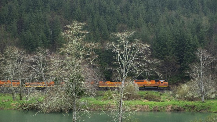 Portland and Western's Toledo Hauler rolls east along the Yaquina River near Elk City, Oregon, on March 20, 2016.