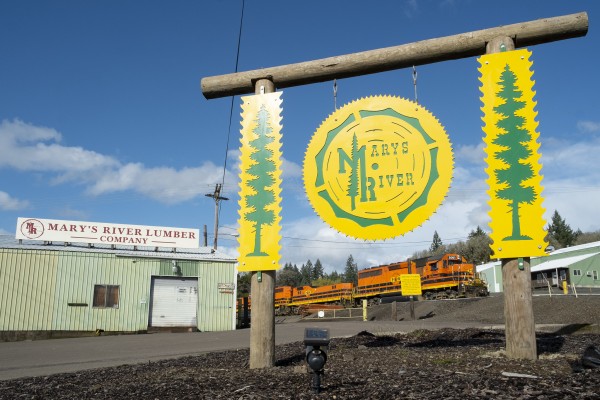 Portland and Western's Toledo Hauler heads east past the Marys River Lumber mill in Philomath, Oregon, on March 20, 2016.