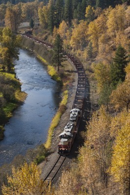On a bright October day in 2008, the St. Maries River Railroad's outbound Clarkia Turn heads up the river with empty log cars.