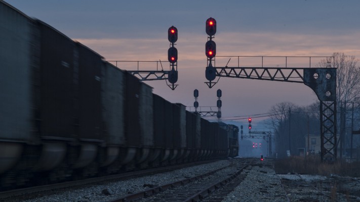 At dawn on the day after Christmas, 2004, an eastbound CSX empty coal train leaves the main line in St. Albans, West Virginia, taking the west leg of wye for the Coal River Subdivision.