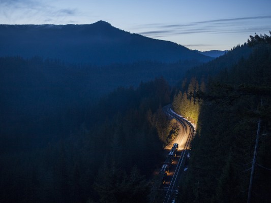 As blue dawn lights the sky at Cruzatte, Union Pacific's Eugene to Roseville (symbol QPWRV) freight train marches south towards Cascade Summit at Cruzatte, Oregon, on May 23, 2009.