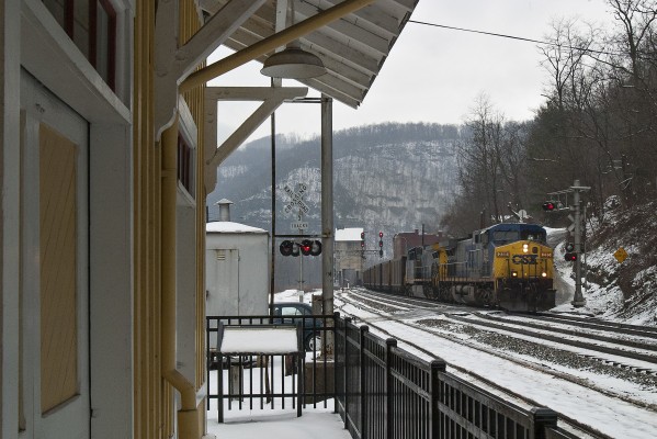 CSX eastbound coal train passing the depot Thurmond, West Virginia, on a dark winter day in the New River Gorge.