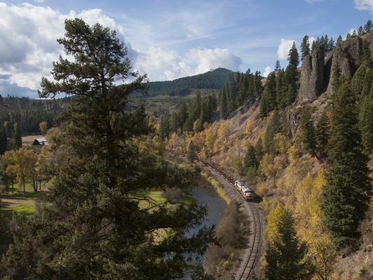St. Maries River Railroad's outbound Clarkia Logger rolls through peak fall foliage at Mashburn, Idaho, in October 2008.