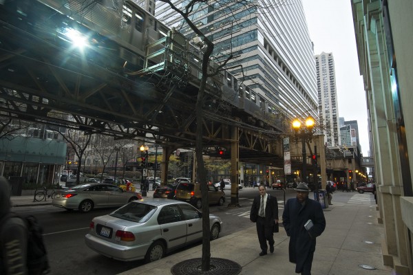 Green Line train arcing near the northwest corner of the Chicago Loop at Lake and Franklin Street.