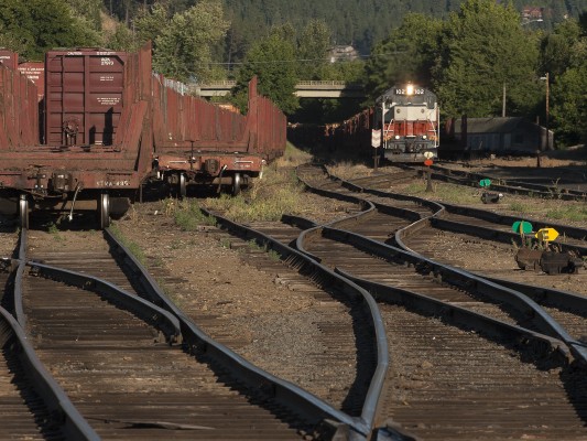 The St. Maries River Railroad's inbound Clarkia logger pulls into the former Milwaukee Road yard in St. Maries, Idaho, at the end of a long day in July 2007.