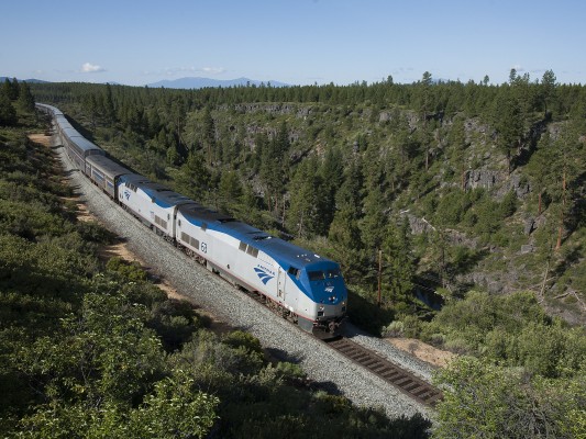 Amtrak's northbound <i>Coast Starlight</i> passenger train no. 14 rolls high above the Williamson River near Kirk, Oregon, the morning of July 8, 2009.