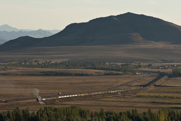 Eastbound Jitong Railway freight train rolling through the mountains around Gulumanhan, Inner Mongolia, China, on the afternoon of October 2, 2005.