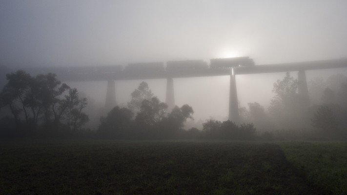 Three SD50s lead a westbound Appalachian & Ohio Railroad empty coal train over Pleasant Creek trestle, seven miles south of Grafton, West Virginia, on a foggy September morning in 2005.