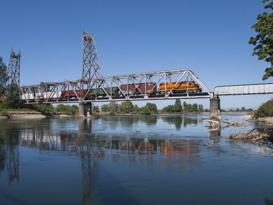 Portland and Western's American Turn local freight train crosses the Willamette River on the former Oregon Electric Railroad between Harrisburg and Junction City, Oregon, on the morning of July 31, 2008.