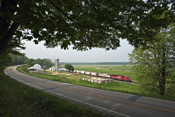 Canadian Pacific southbound freight train no. 170 passing a farm along U.S. 52 near Green Island, Iowa, on May 6, 2012.