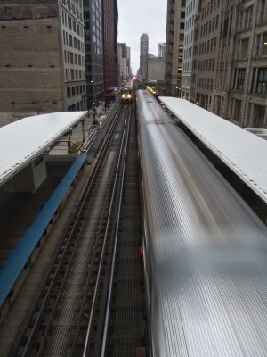 Two Chicago L trains passing at Adams station in the Loop.