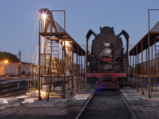 Jitong Railway welders prepare new fueling racks in Daban for the diesel locomotives that will replace steam in just two months.