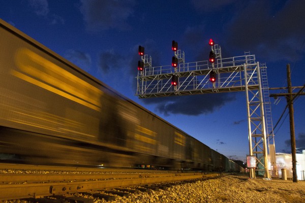 Westbound CSX loaded coal train passing under a new signal bridge in St. Albans, West Virginia, at dusk on a December day in 2008.