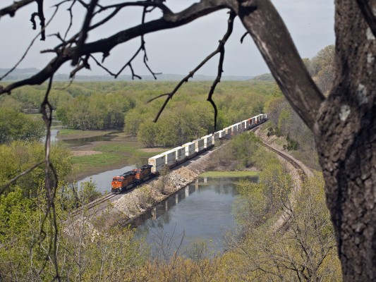 BNSF eastbound doublestack intermodal train along the Mississippi River and about to cross the Sinsinawa River near Galena, Illinois, on the morning of April 7, 2012.