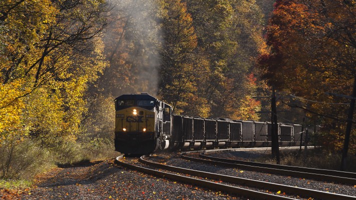 Two CSX diesel locomotives lug an eighty-car coal train up Cranberry Grade near Terra Alta, West Virginia, on the railroad's aptly-named Mountain Subdivision.