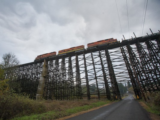 Portland and Western's Harbor Turn crossing Holcomb Creek Trestle near Helvetia, Oregon, on October 30, 2009. This is the largest timber railroad trestle still in use.