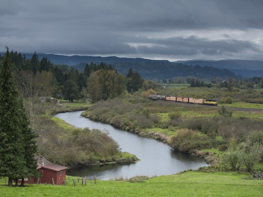 Portland and Western's Wauna Turn heads east on the Astoria Line along Beaver Creek with seven cars on October 14, 2010.