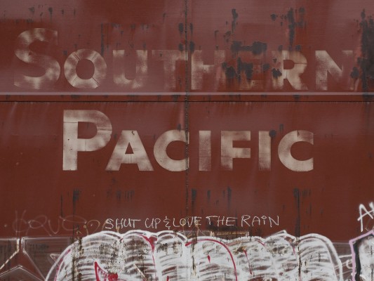 Graffiti on a former Southern Pacific wood chip car offers good advice for life in western Oregon.