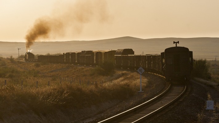 Westbound Jitong Railway freight train heads off into the sunset at Chagganhada.