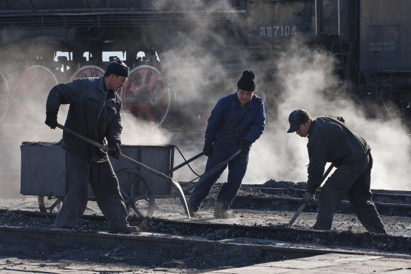 Jitong Railway workers in the Daban ashpit in November 2005.