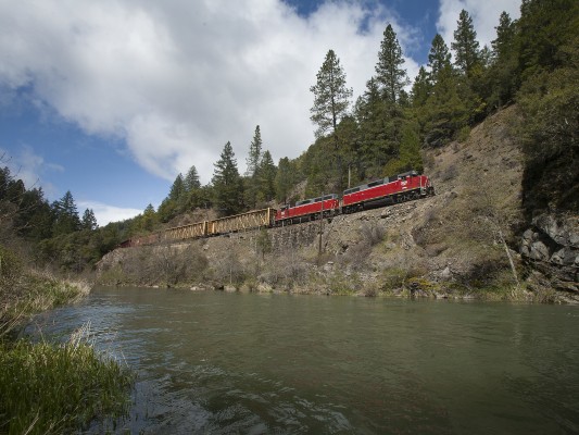 Central Oregon and Pacific Railroad freight train following Cow Creek between Riddle and Glendale, Oregon, on April 8, 2010.