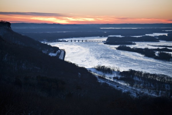 BNSF eastbound intermodal train ZSTPCHC heading down the Mississippi River at Trempealeau, Wisconsin, as the sun rises on the shortest day of 2012, December 21.