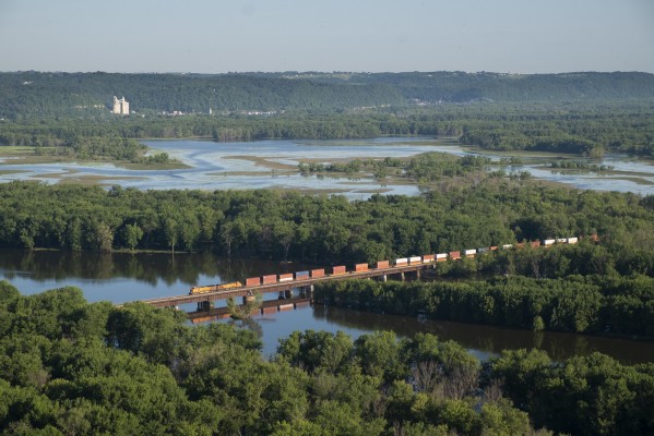 A BNSF eastbound stack train crosses the Wisconsin River on the morning of July 17, 2018. For the hundreds of trains I've photographed in this part of world over the last seven years, this was the first time I'd taken this classic shot in full morning sunlight.